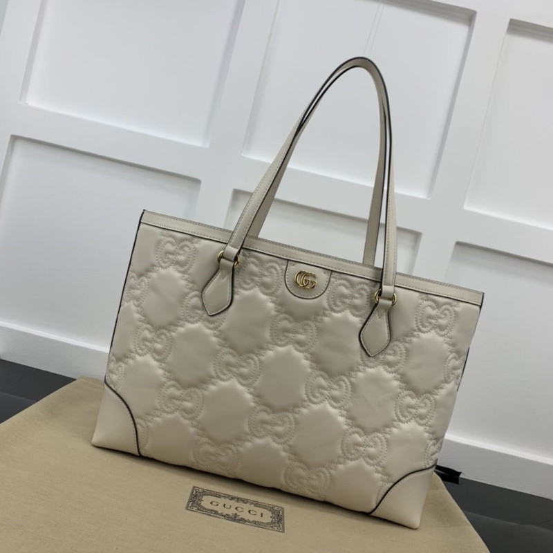 G*u*i shopping bags
